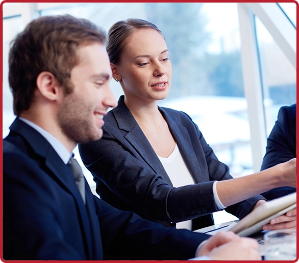 Two professionals collaborating and learning, representing effective professional development courses for employees offered by AZEE Training.